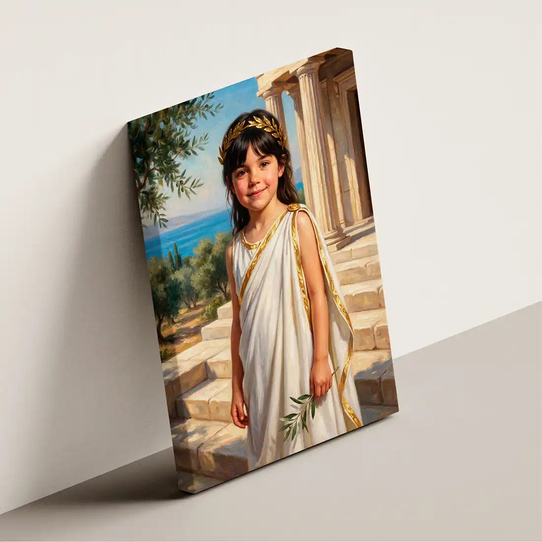 A rectangular canvas wall art print shown standing at an angle against a light gray wall. The artwork depicts a young girl in a white toga with gold trim and a gold laurel wreath, standing on stone steps with a blue sea and trees in the background.