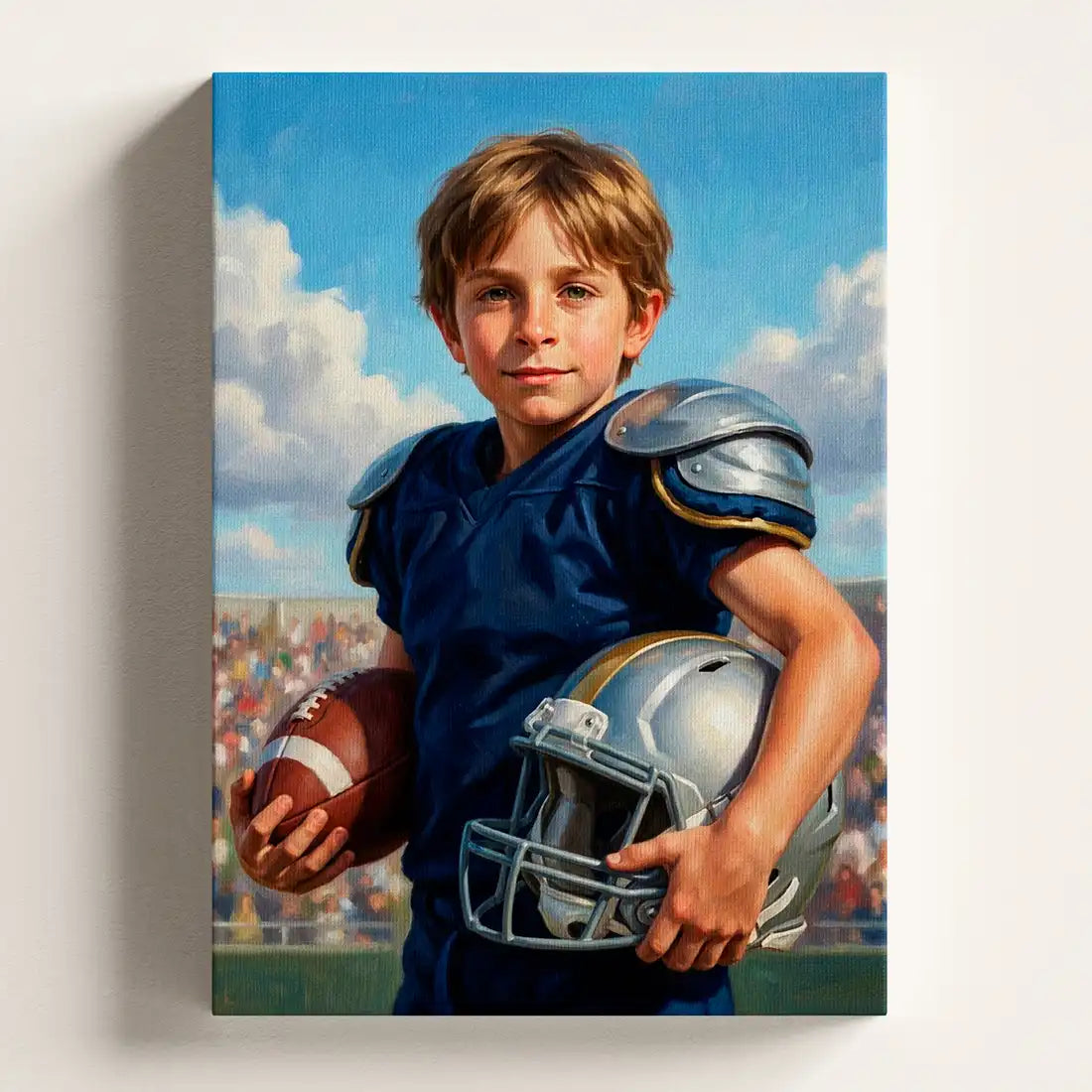 A vertical canvas wall art print featuring a painted portrait of a young boy in a blue football uniform holding a football and helmet, displayed against a light gray wall.