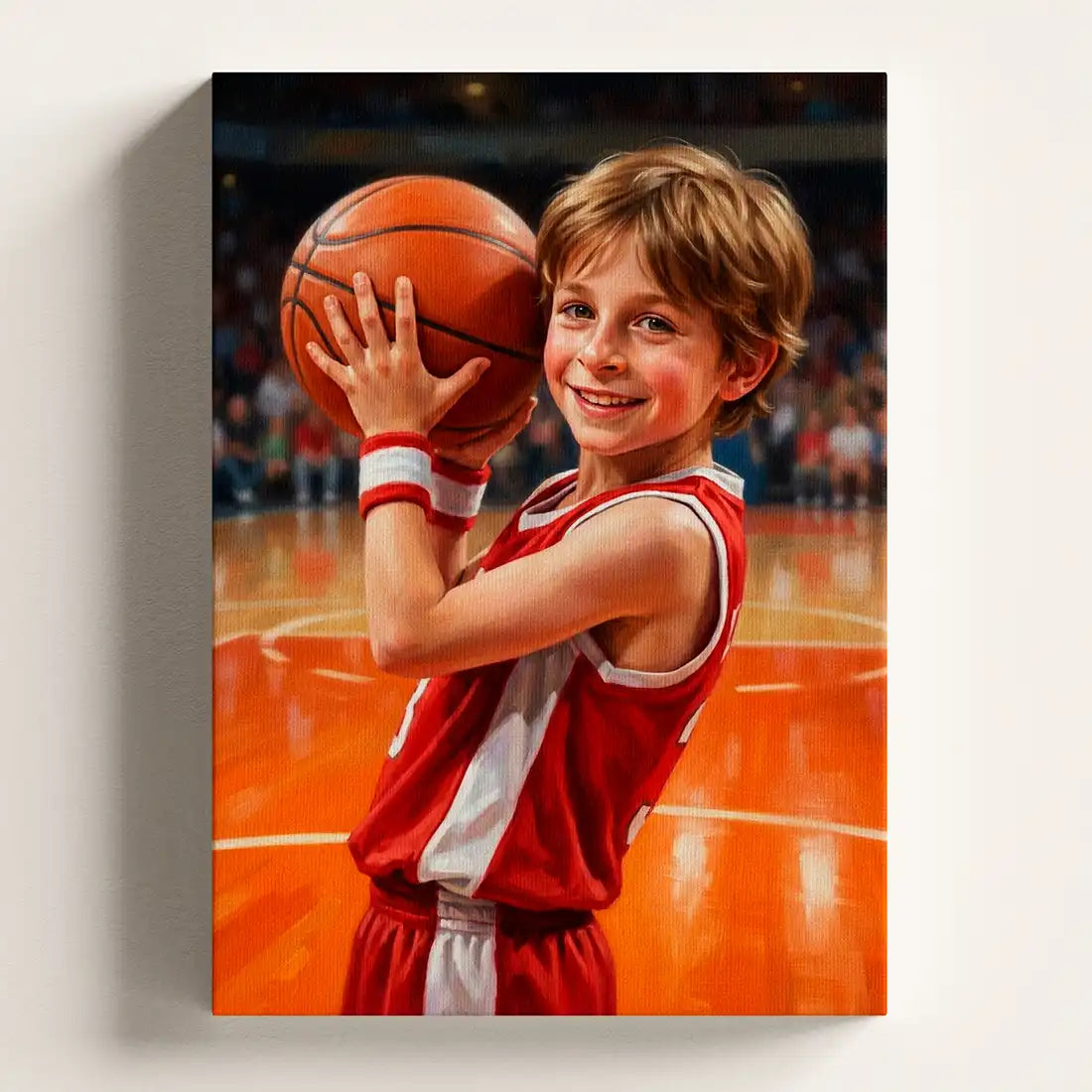 A vertical canvas wall art print depicting a young boy smiling and holding a basketball on an orange basketball court, shown hanging on a light gray wall.