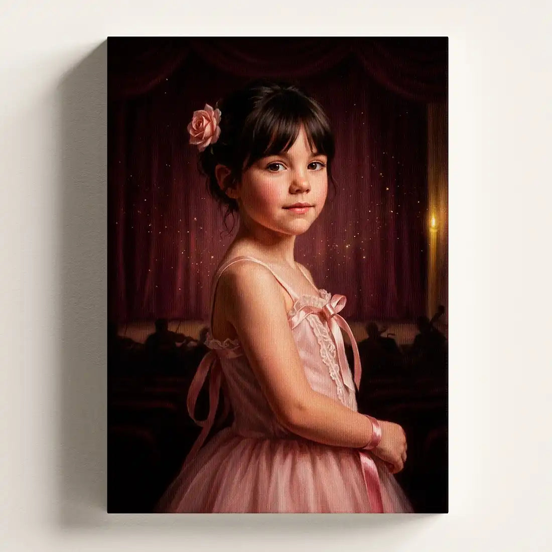A vertical canvas wall art print featuring a portrait of a young girl in a pink dress against a dark red curtain background, shown hanging on a light gray wall.