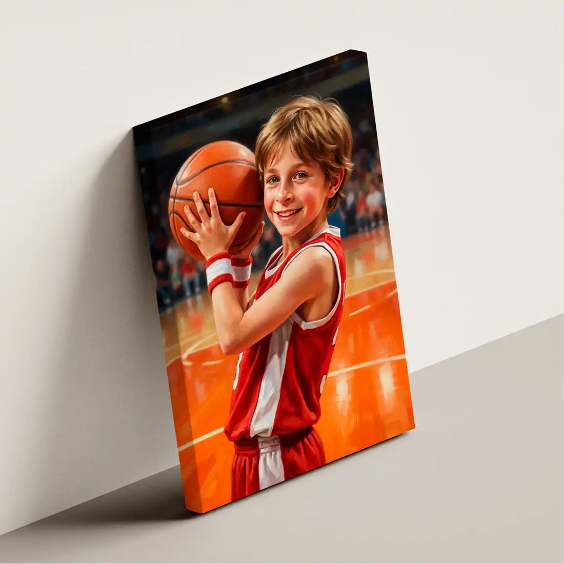 A rectangular canvas wall art print leaning against a light gray wall, showing a painted portrait of a young boy in a red basketball jersey holding a basketball on an indoor court. The product itself is the printed canvas, not the person depicted, so this is Product/Packaging rather than Lifestyle or Scenery.