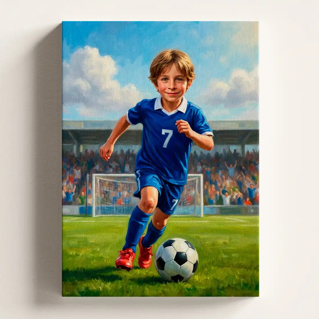 A custom canvas wall art print depicting a young boy soccer player in a blue jersey with the number 7, dribbling a soccer ball on a green field with a stadium crowd in the background, shown hanging on a light beige wall.