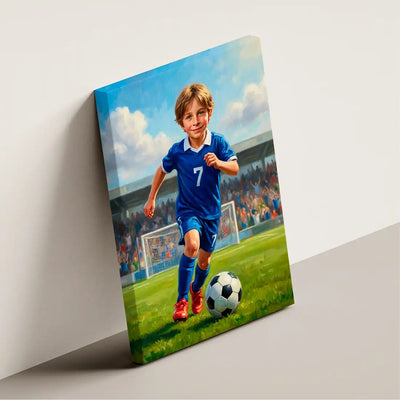 A rectangular canvas print leaning against a light gray wall, showing a painted scene of a young boy in a blue soccer jersey running on a green field with a soccer ball. The canvas is photographed in a studio-like setting with a soft shadow on the left.