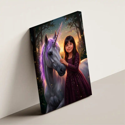 A vertical canvas print leaning against a light beige wall, featuring a fantasy illustration of a young girl in a dark purple dress touching the horn of a white unicorn with glowing purple hair in a magical forest.